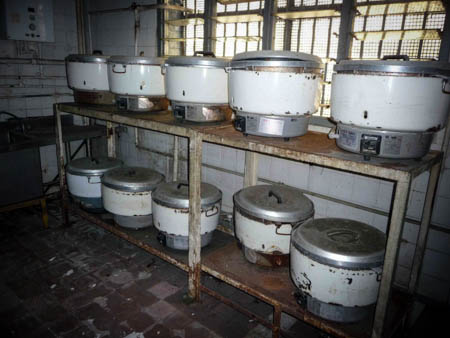 The ground level of C Hall houses a kitchen, where ten large rice cookers are placed.