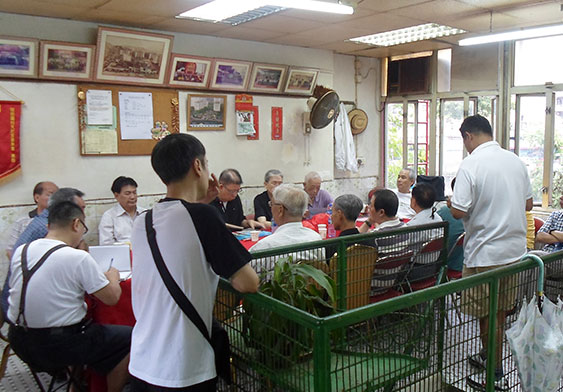 Kong Chi Yin reminiscences in front of his old house