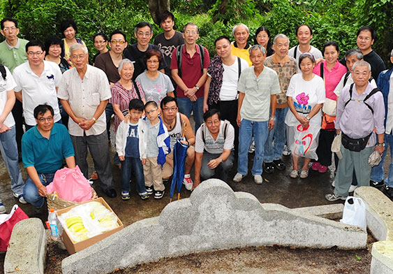 Photographed in front of the ancestral grave of Ng Hon Ko Tso