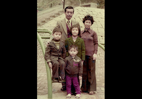 Ng Hung On pictured with his wife and children