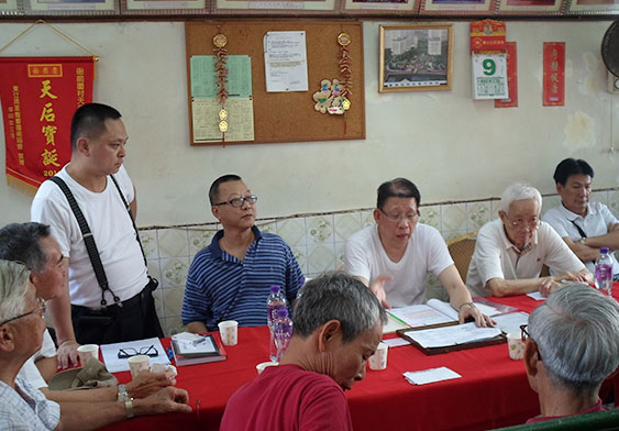 Manager of the 3rd Branch at a meeting in Village Office