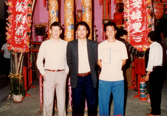 Kong Chi Yin, Ng Chi Wing and Ng Siu Kei photographed at the ritual shed