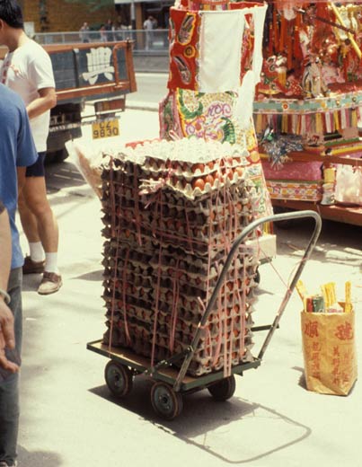 Stacks of red dyed eggs as offerings